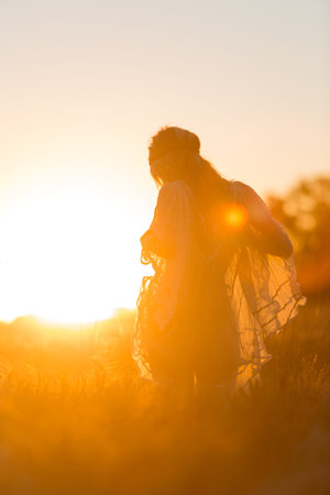 Sexy young Girl in corn fields at sunset with transparent clothes.の写真素材