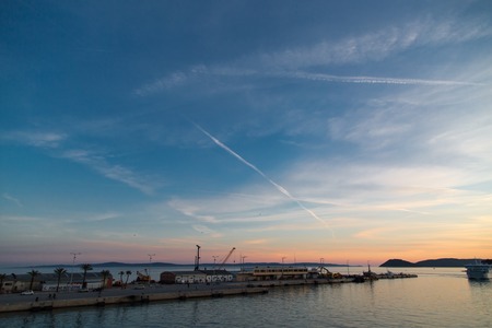 Golden hour at harbor in city of split, croatia. Boats, clouds and skyの写真素材