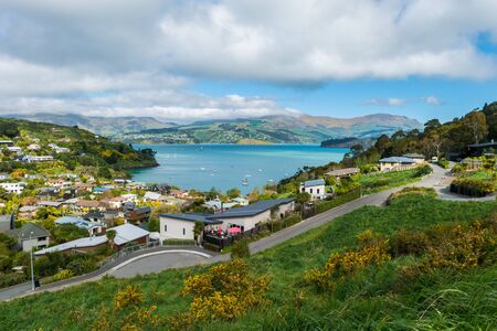 Little town at Lyttelton harbour in the Banks Peninsula on New Zealand's South Island. Nestled in the green hills of the volcanic peninsula this little gem has fantastic views of the bay.の写真素材