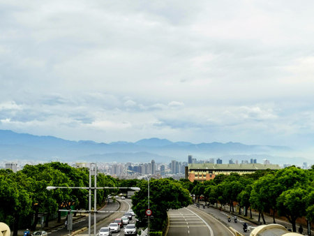 You can see an everyday view from a pedestrian bridge. The view is over the city of Taichung and at...