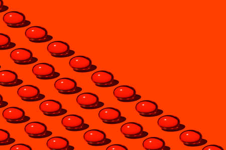 Red pills half the screen diagonallyの写真素材