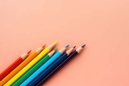 Colored pencils on pink paperの写真素材