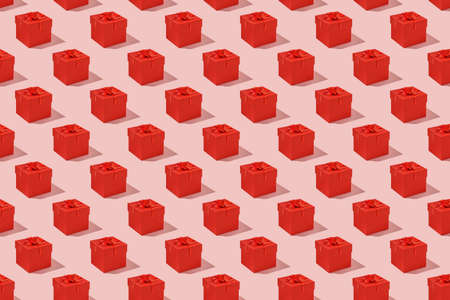 Pattern: red gift boxes on pink backgroundの写真素材