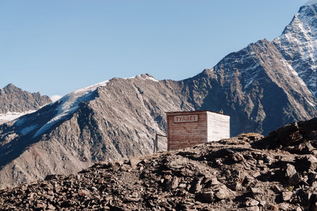 Small wooden structure is high in the mountains
