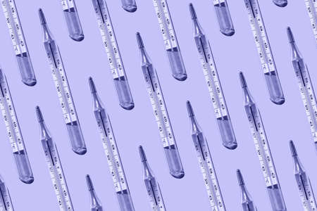 Medical mercury thermometers pattern close-up on very peri background.の写真素材