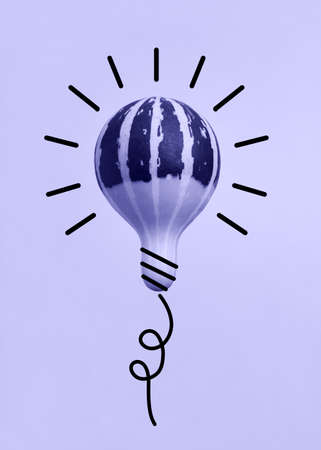 Very peri pumpkin in the form of a light bulbの写真素材