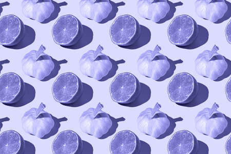 Lime halves and bulbs of garlic very peri colorの写真素材