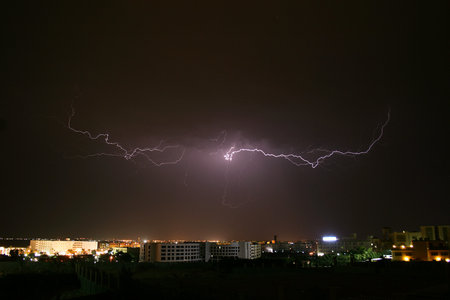 Bolt of lightning over the outskirts of a town
