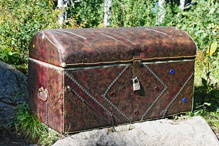 Old locked chest on a stoneの写真素材