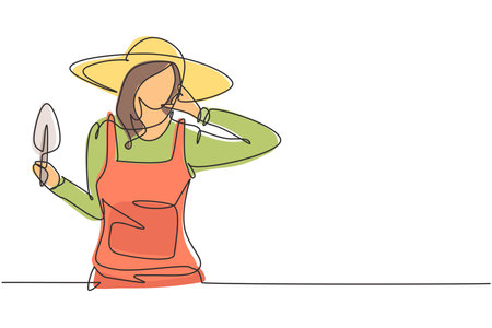 Single one line drawing female farmer with call me gesture wearing straw hat and carrying mini shovel to work on the farm. Success business. Continuous line draw design graphic vector illustrationのイラスト素材