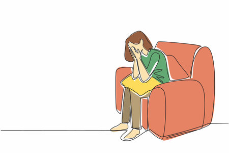 Continuous one line drawing woman sitting on a single sofa covering face with both palms. Receiving bad treatment. Stress. National Anxiety Screening Day. Single line draw design vector illustrationのイラスト素材