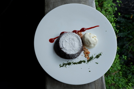 It is Time for Dessert, Molten Lava Cake with Vanilla Ice Cram and Strawberry Sauceの写真素材