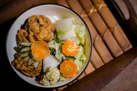 Photograph of Chicken Main Course from Hype Cafe with Wood Background and from Top Viewの写真素材