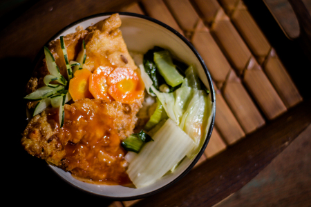 Photograph of Chicken Main Course from Hype Cafe with Wood Background and from Top Viewの写真素材