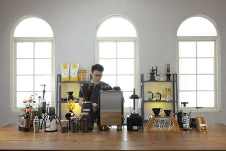 A Professional barista preparing and demonstrating coffee alternative method at the coffee shop with beautiful cafe concept.のeditorial素材