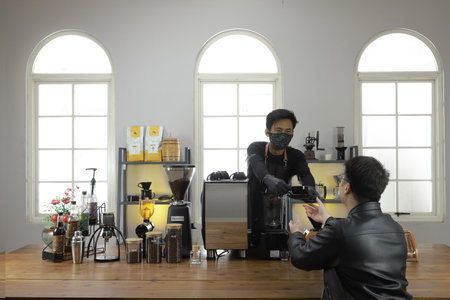 A Professional barista preparing and demonstrating coffee alternative method at the coffee shop with beautiful cafe concept.のeditorial素材