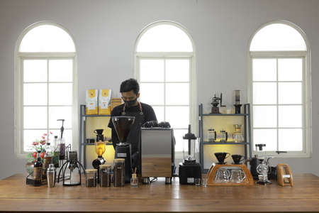 A Professional barista preparing and demonstrating coffee alternative method at the coffee shop with beautiful cafe concept.のeditorial素材