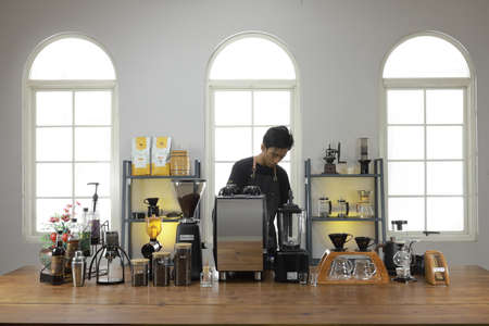 A Professional barista preparing and demonstrating coffee alternative method at the coffee shop with beautiful cafe concept.のeditorial素材