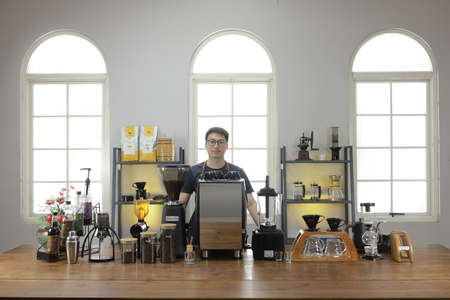 A Professional barista preparing and demonstrating coffee alternative method at the coffee shop with beautiful cafe concept.のeditorial素材