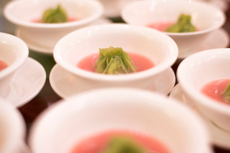 Distributing Beetroot Soup with Juice dumpling in Vegetarian Banquetの写真素材