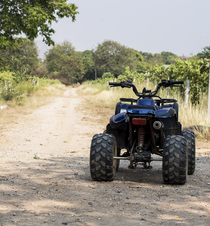 ATV on the road in grape farm.の写真素材