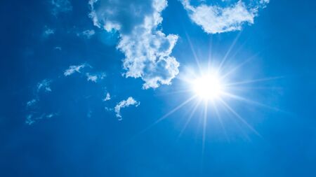 blue sky with cloud and the sunの写真素材