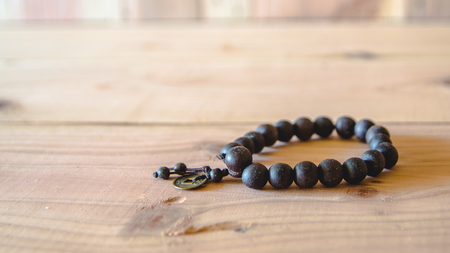 wooden bead with lucky coin for good fortuneの写真素材