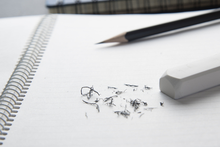 Close up white eraser on blank notebbokの写真素材