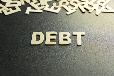 DEBT word made with wooden letterの写真素材