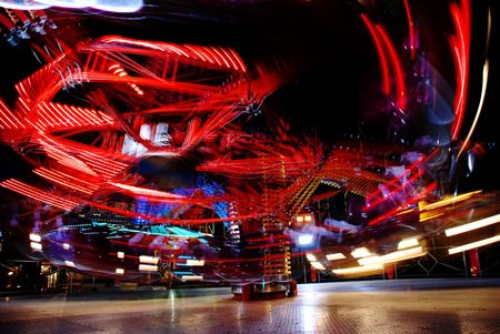 terrific speed of carousel in evening parkの写真素材