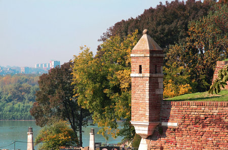 brick tower over autumn trees in park Kalemegdan in Belgradeの写真素材