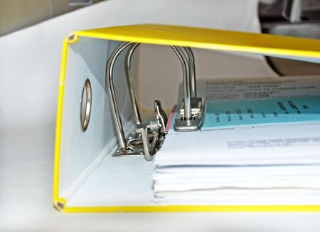 documents in paper file with metallic lock mechanismの写真素材