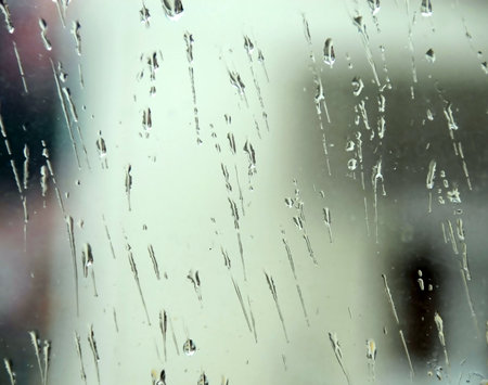 rain drops on window glass natural background