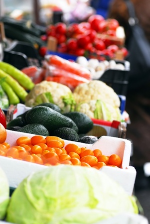 various colorful fruits and vegetables on market stand outdoorの写真素材