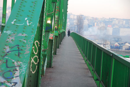 green fence and construction of old Sava bridge in Belgrade, Serbiaの写真素材
