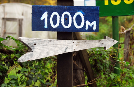 Rustic wooden road right direction arrow signの写真素材
