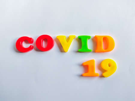 Inscription COVID-19 on white background. WHO introduced new official name for Coronavirus disease named COVID-19の写真素材