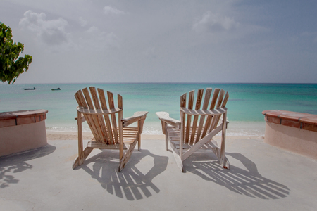 Chairs overlooking the oceanの写真素材