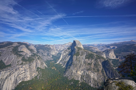 Panoramic view of the mountain range in Yosemite National Park with Half Dome in the centerの写真素材