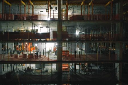 Aerial view of the high rise construction site at nightの写真素材
