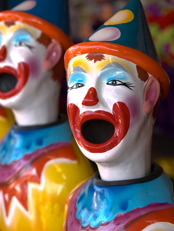 Line of ceramic clown head with open mouths at a game at the Canadian National Exhibition, Toronto, Ontario, Canada.のeditorial素材
