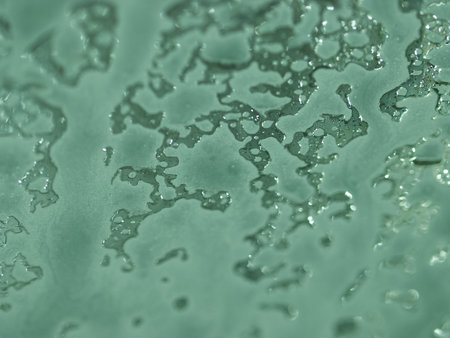 Soap suds on a windshield at the car wash.