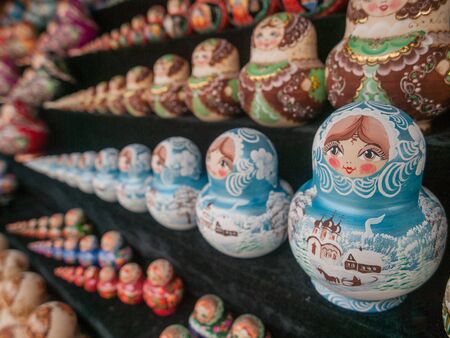 Russian nesting dolls in various colours at Izmailovsky Souvenir Market in Moscow.の写真素材