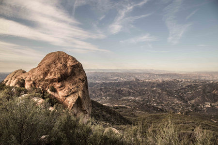 View from backbone hiking trail with large boulders, in Los Angeles County, Malibu, California