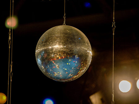 Discoball with blurred lights in the background.