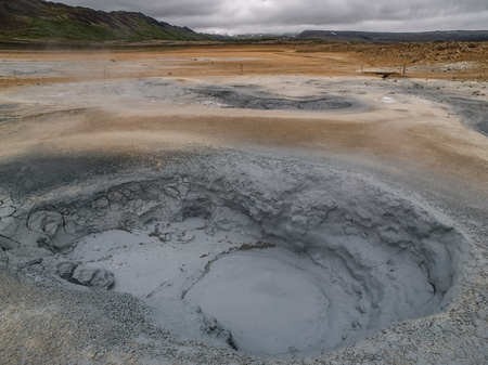 Mud pot and geothermal activity at Namaskard, Myvatn, Iceland.の写真素材