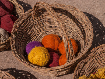 Alpaca dyed colourful yarn in baskets in Peru, South America.