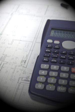 Calculations and designing on office deskの写真素材