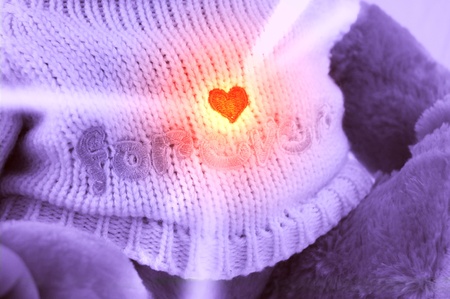 Valentine teddy-bear with lighting heartの写真素材