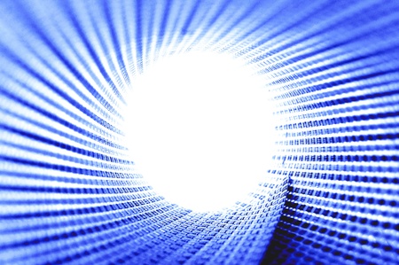 Bright circle light on blue material textureの写真素材